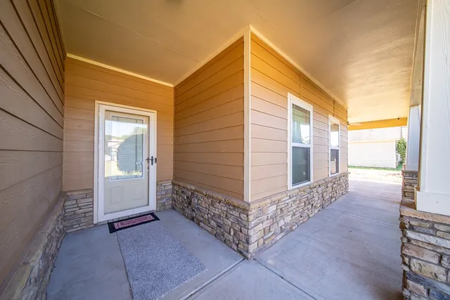 a view of a house with wooden fence