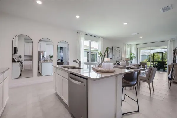 a kitchen with counter top space and sink
