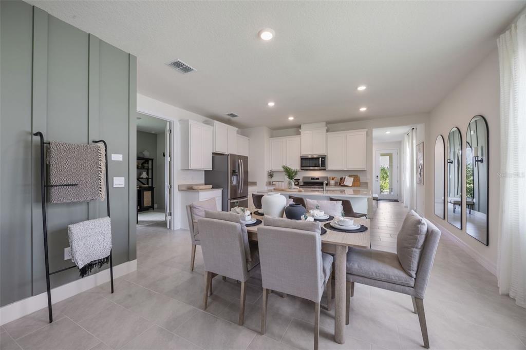 3961 Kennebunk Loop Mount Dora, FL 32757 - Photo 15 of 51 a view of a dining room with furniture