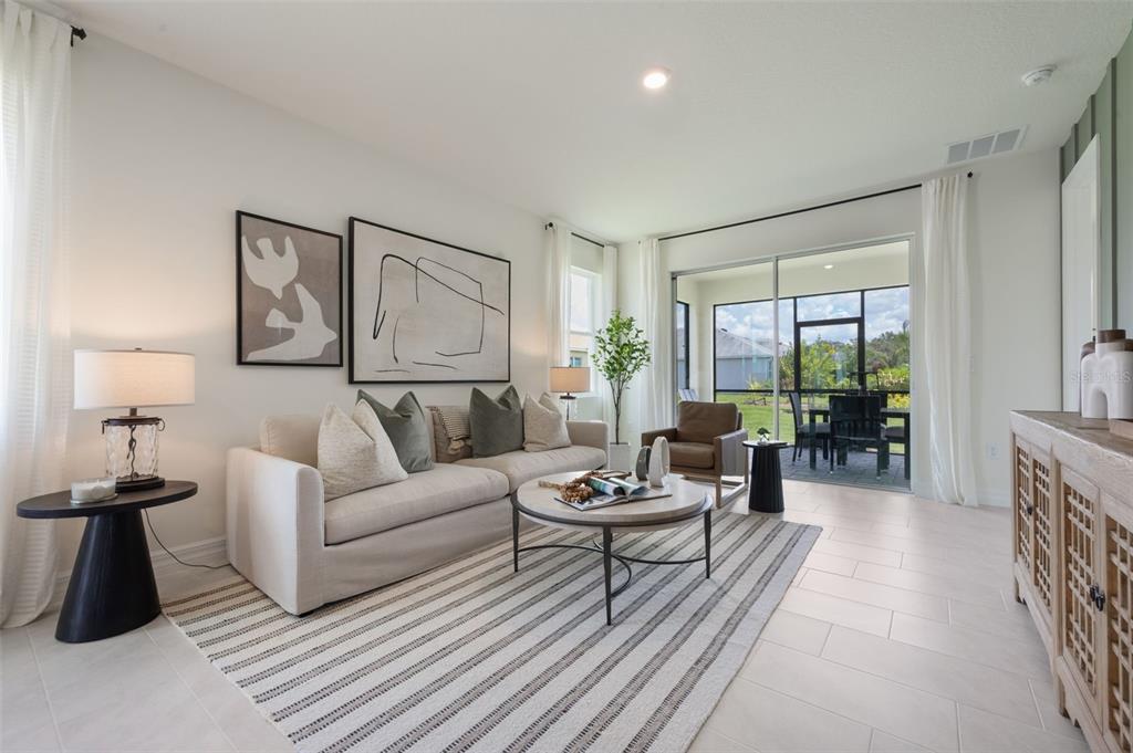 3961 Kennebunk Loop Mount Dora, FL 32757 - Photo 19 of 51 a living room with furniture and a large window