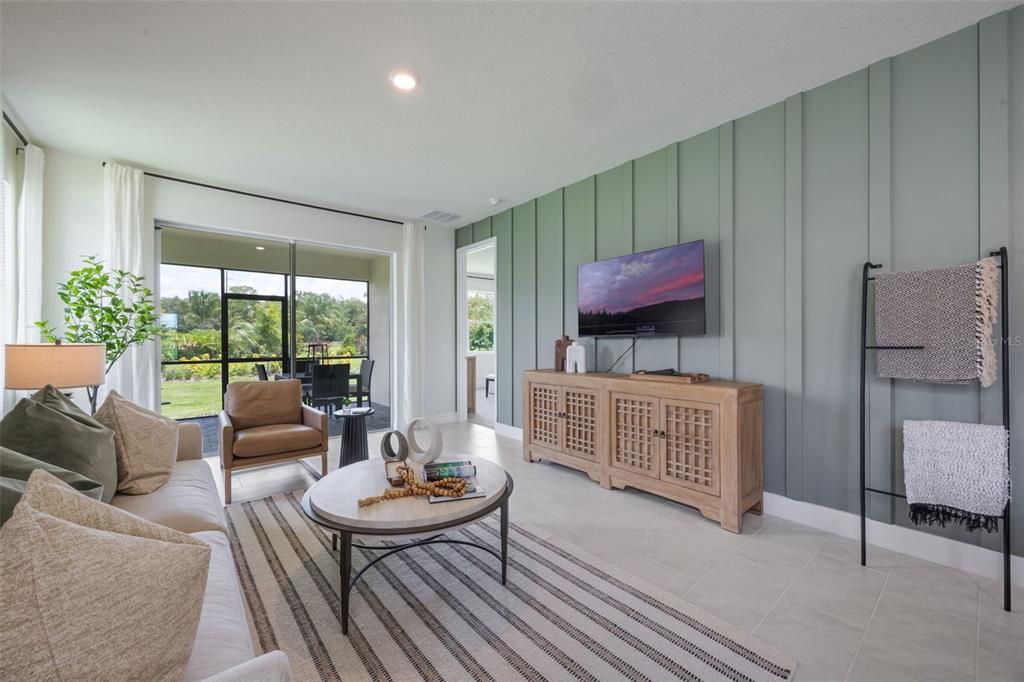 3961 Kennebunk Loop Mount Dora, FL 32757 - Photo 23 of 51 a living room with furniture and a large window