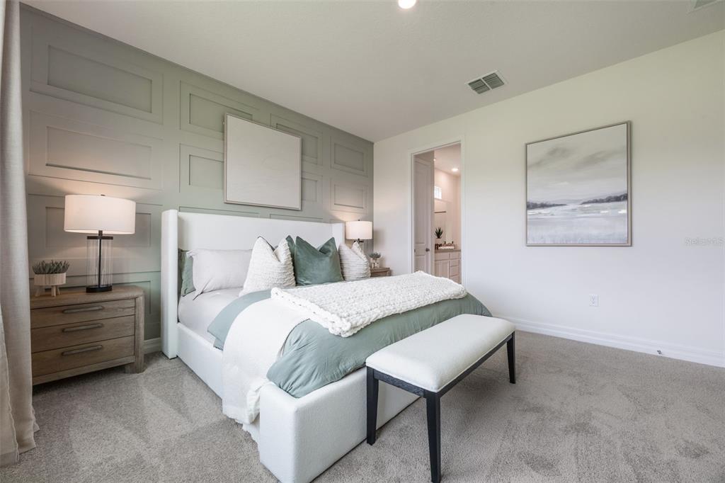 3961 Kennebunk Loop Mount Dora, FL 32757 - Photo 26 of 51 a bedroom with a bed and a lamp on dresser