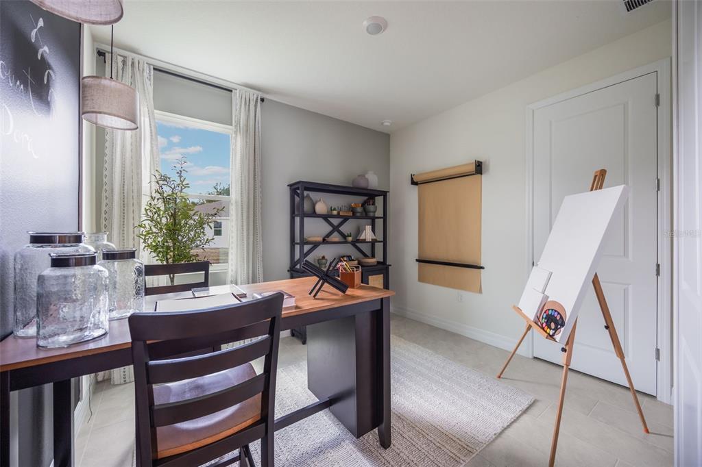 3961 Kennebunk Loop Mount Dora, FL 32757 - Photo 29 of 51 a view of a dining room with furniture and a window