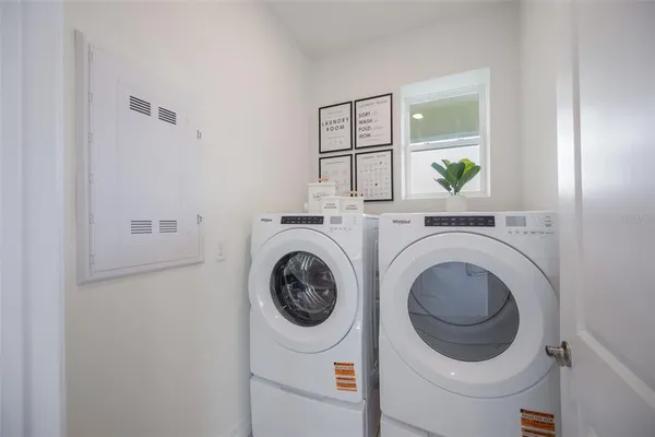 a bathroom with a granite countertop sink toilet a mirror and shower