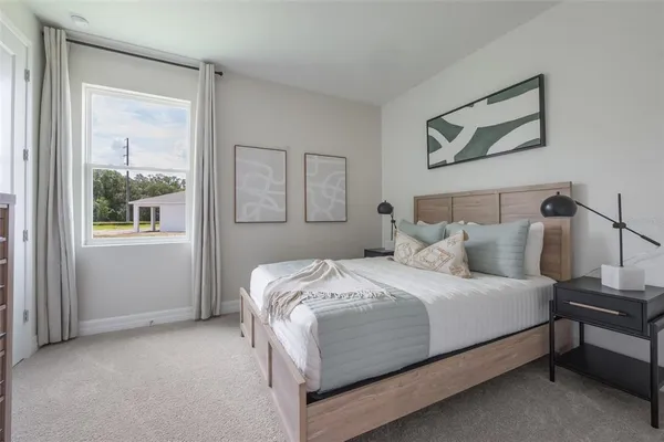 a bedroom with a bed and a dresser
