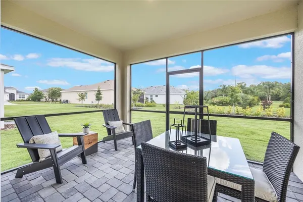 a view of a dining room with furniture and window