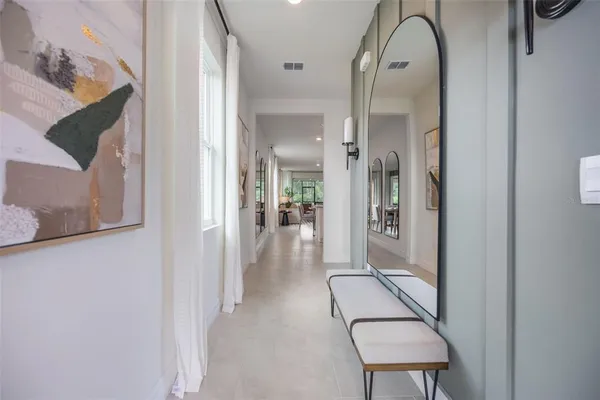 hallway with wooden floor and glass door
