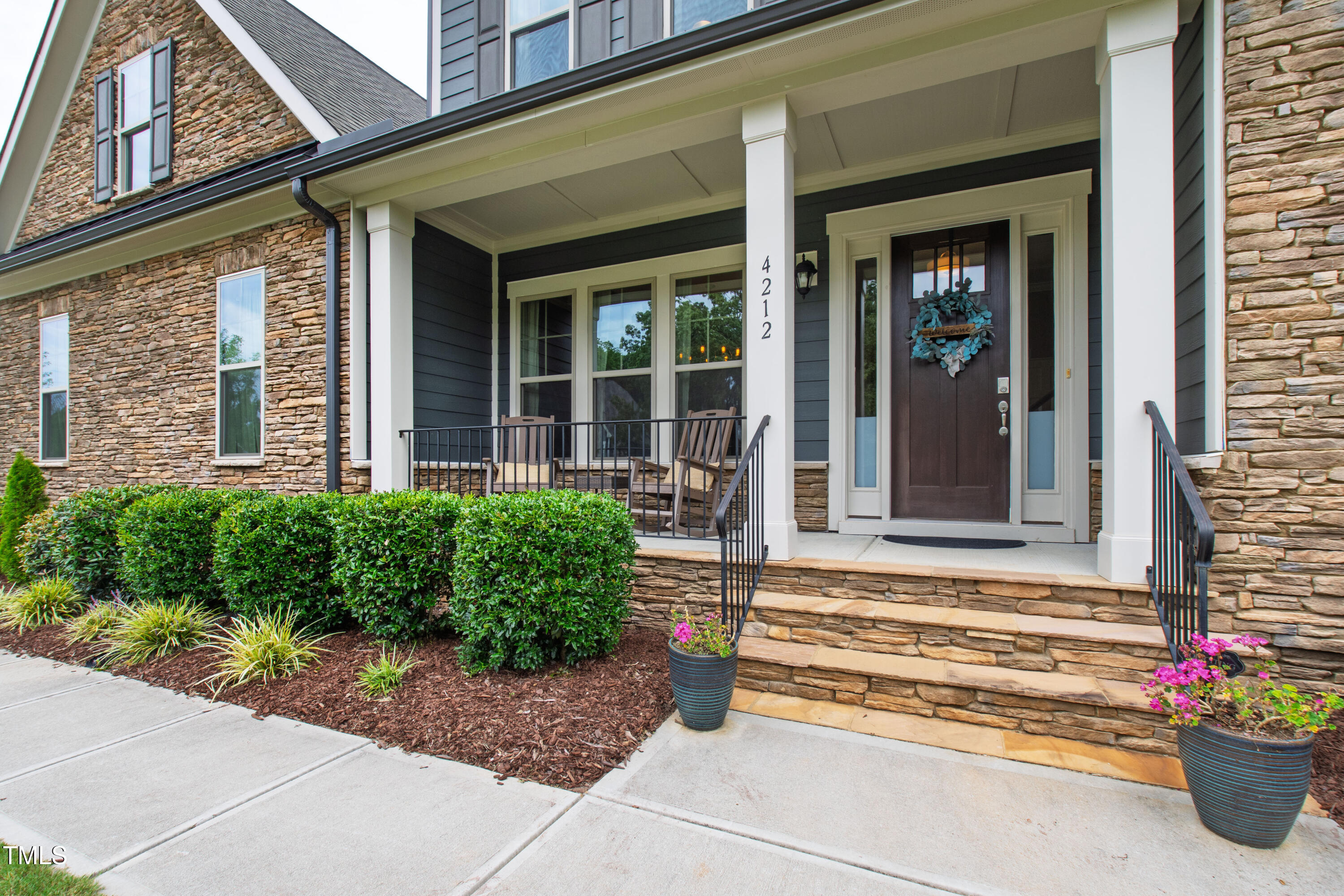 4212 Banks Stone Drive Raleigh, NC 27603 - Photo 13 of 69 a front view of a house with a yard