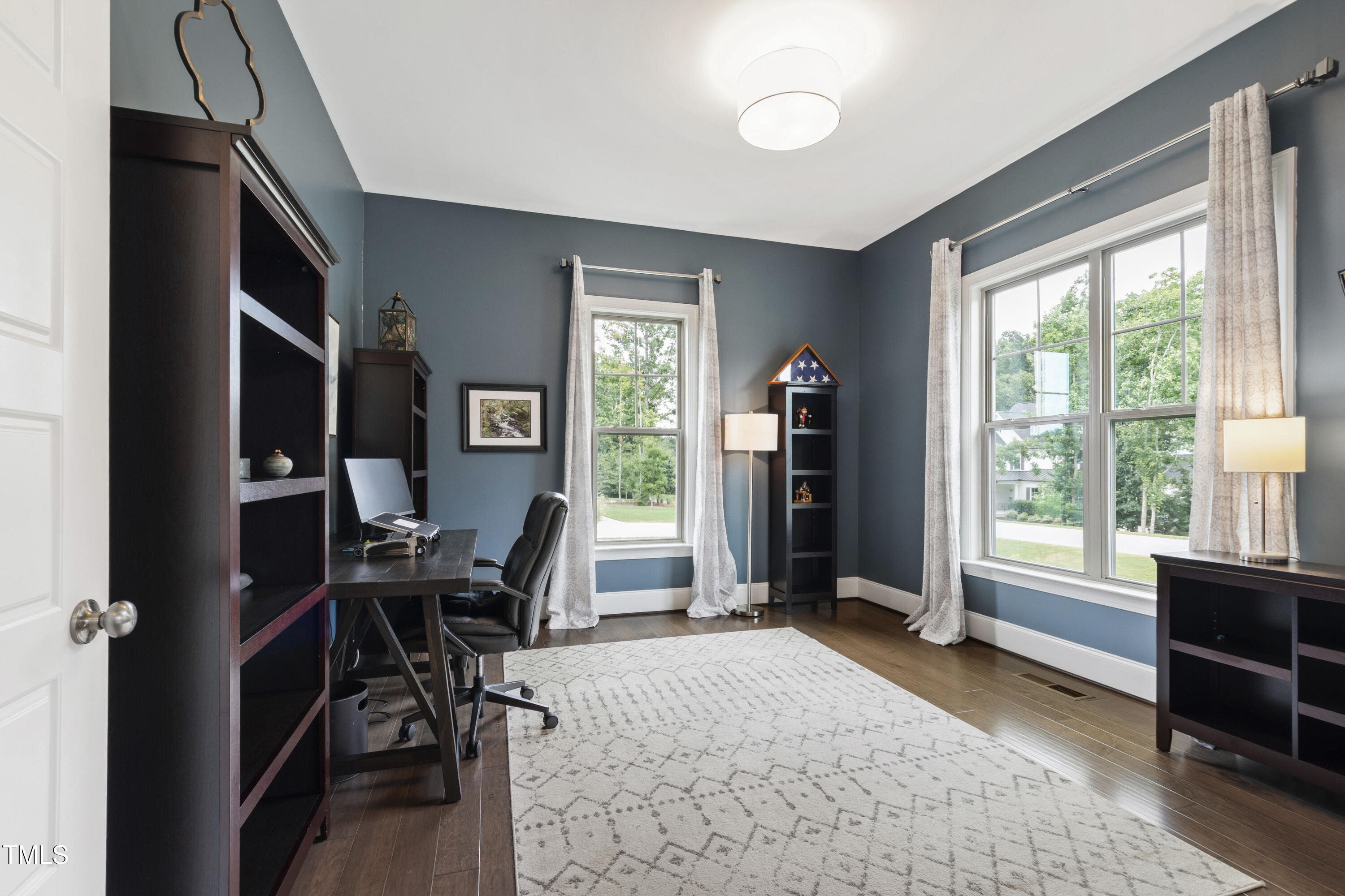 4212 Banks Stone Drive Raleigh, NC 27603 - Photo 17 of 69 a view of a livingroom with workspace and a window