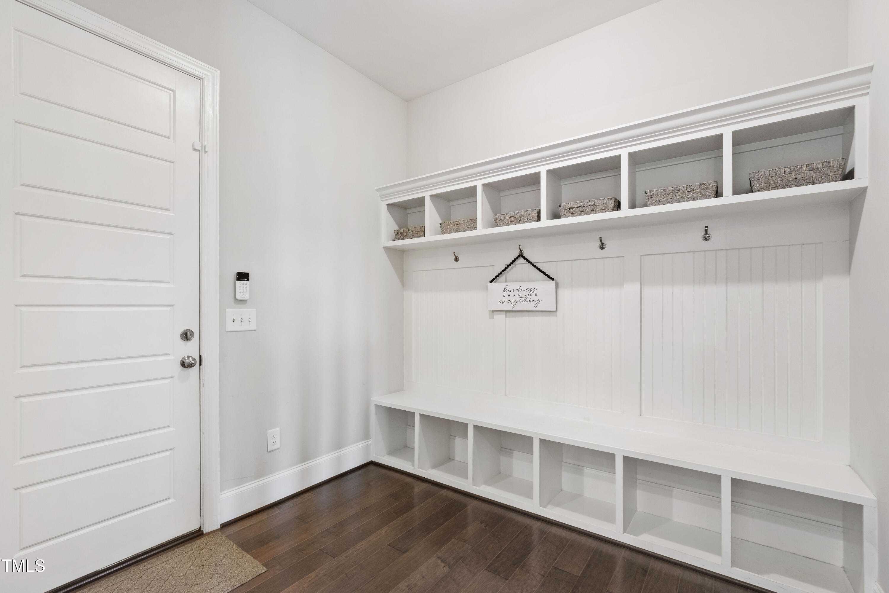 4212 Banks Stone Drive Raleigh, NC 27603 - Photo 32 of 69 a view of an empty room with wooden floor and cabinet