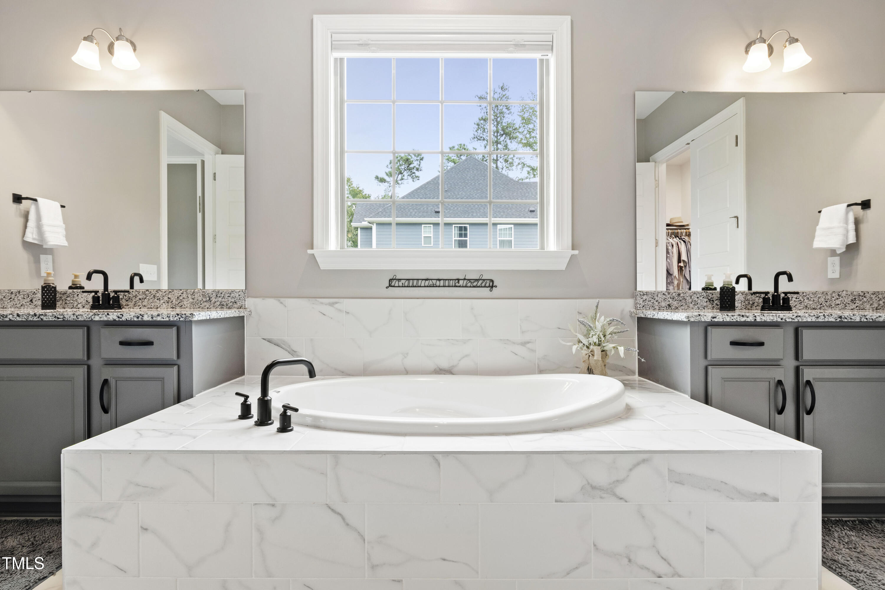 4212 Banks Stone Drive Raleigh, NC 27603 - Photo 39 of 69 a bathroom with a sink and a mirror