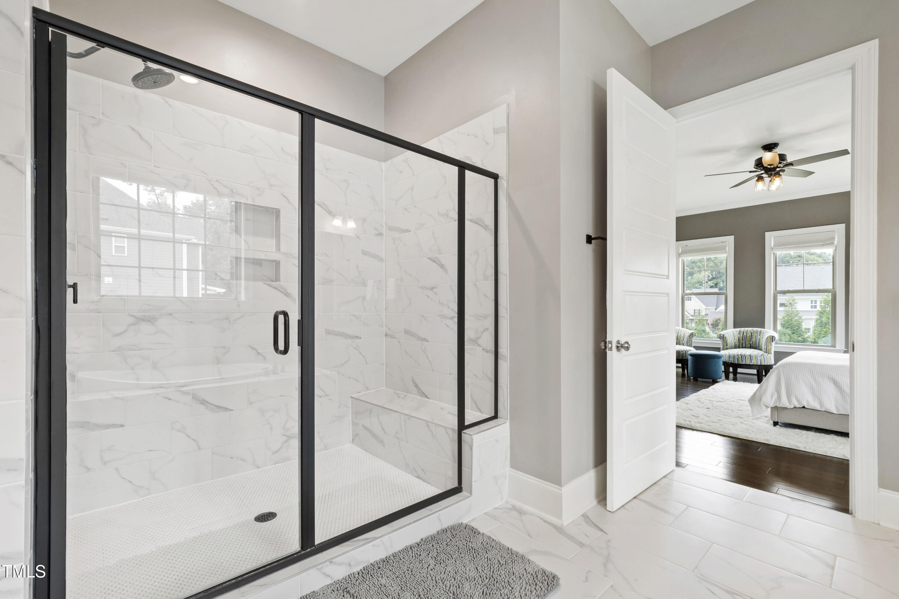 4212 Banks Stone Drive Raleigh, NC 27603 - Photo 40 of 69 a living room with a glass door shower and fireplace