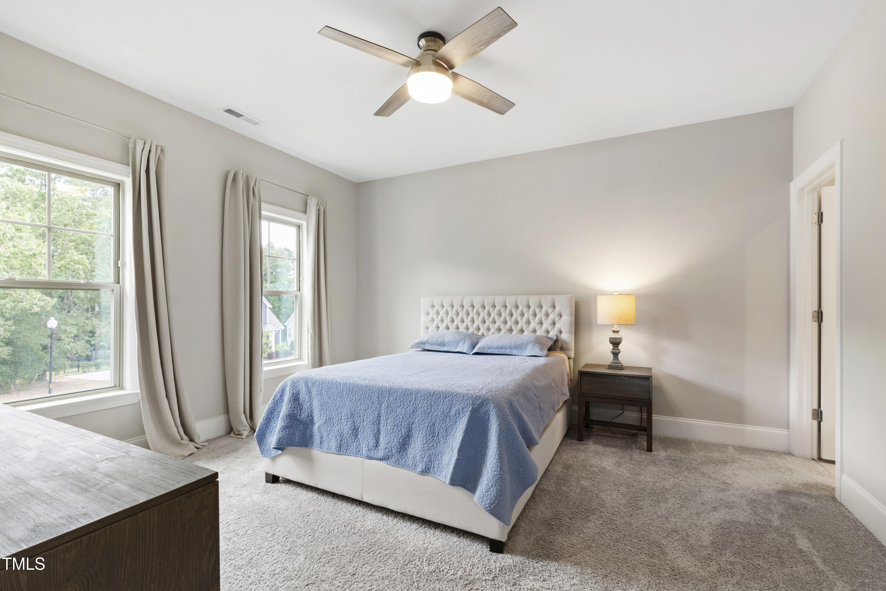 4212 Banks Stone Drive Raleigh, NC 27603 - Photo 43 of 69 a bedroom with a bed and a window