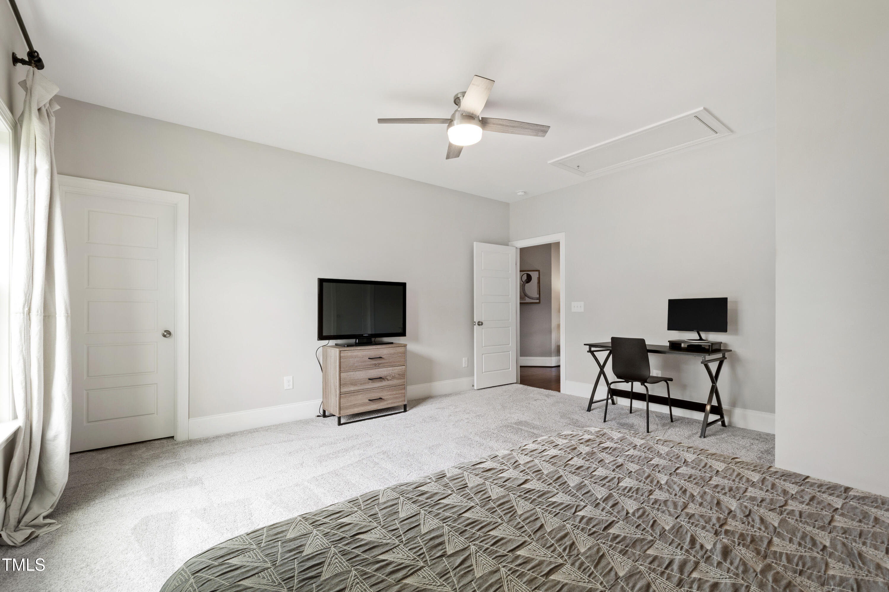 4212 Banks Stone Drive Raleigh, NC 27603 - Photo 48 of 69 a living room with furniture and a flat screen tv
