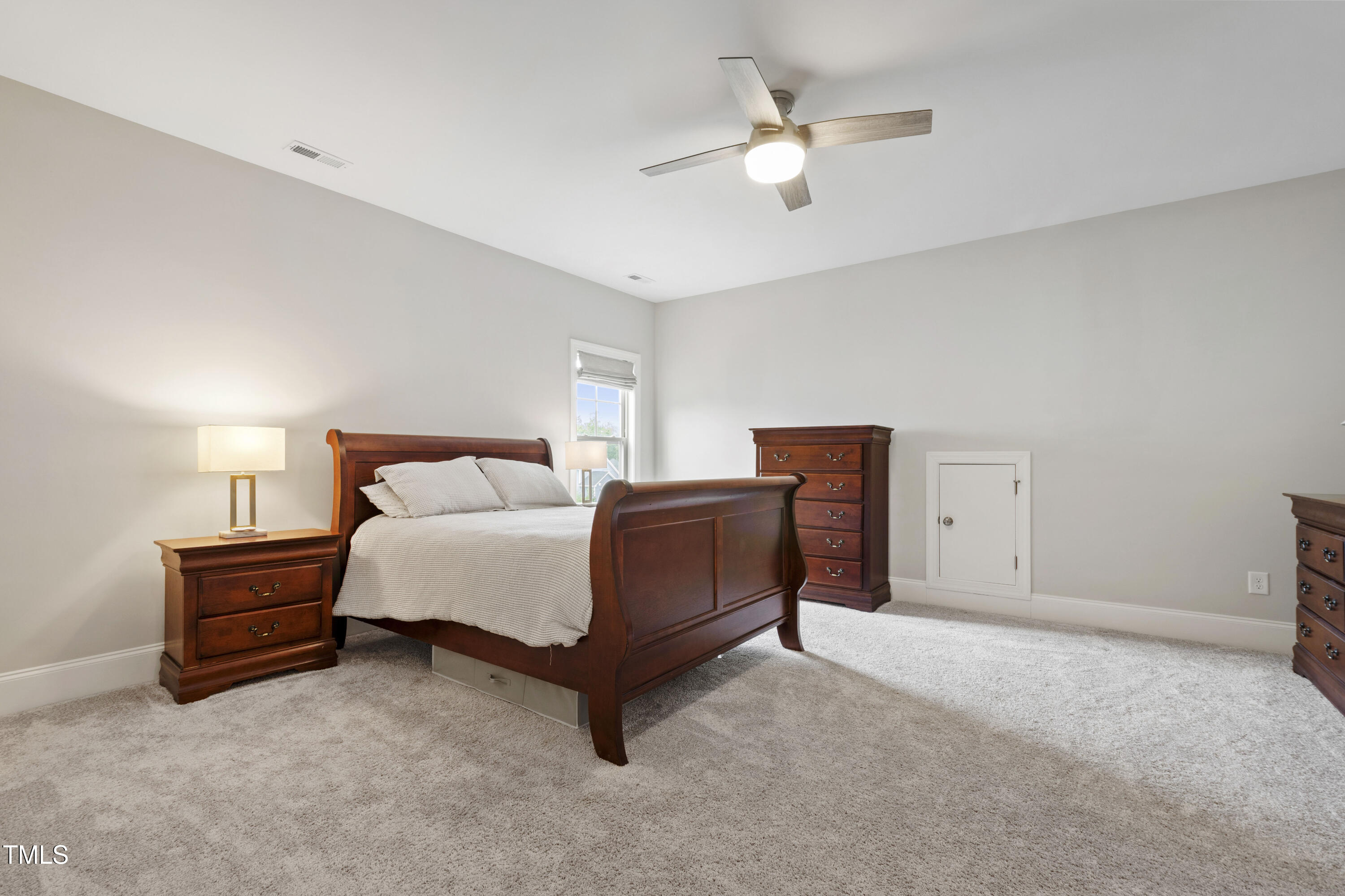 4212 Banks Stone Drive Raleigh, NC 27603 - Photo 51 of 69 a bedroom with bed and window