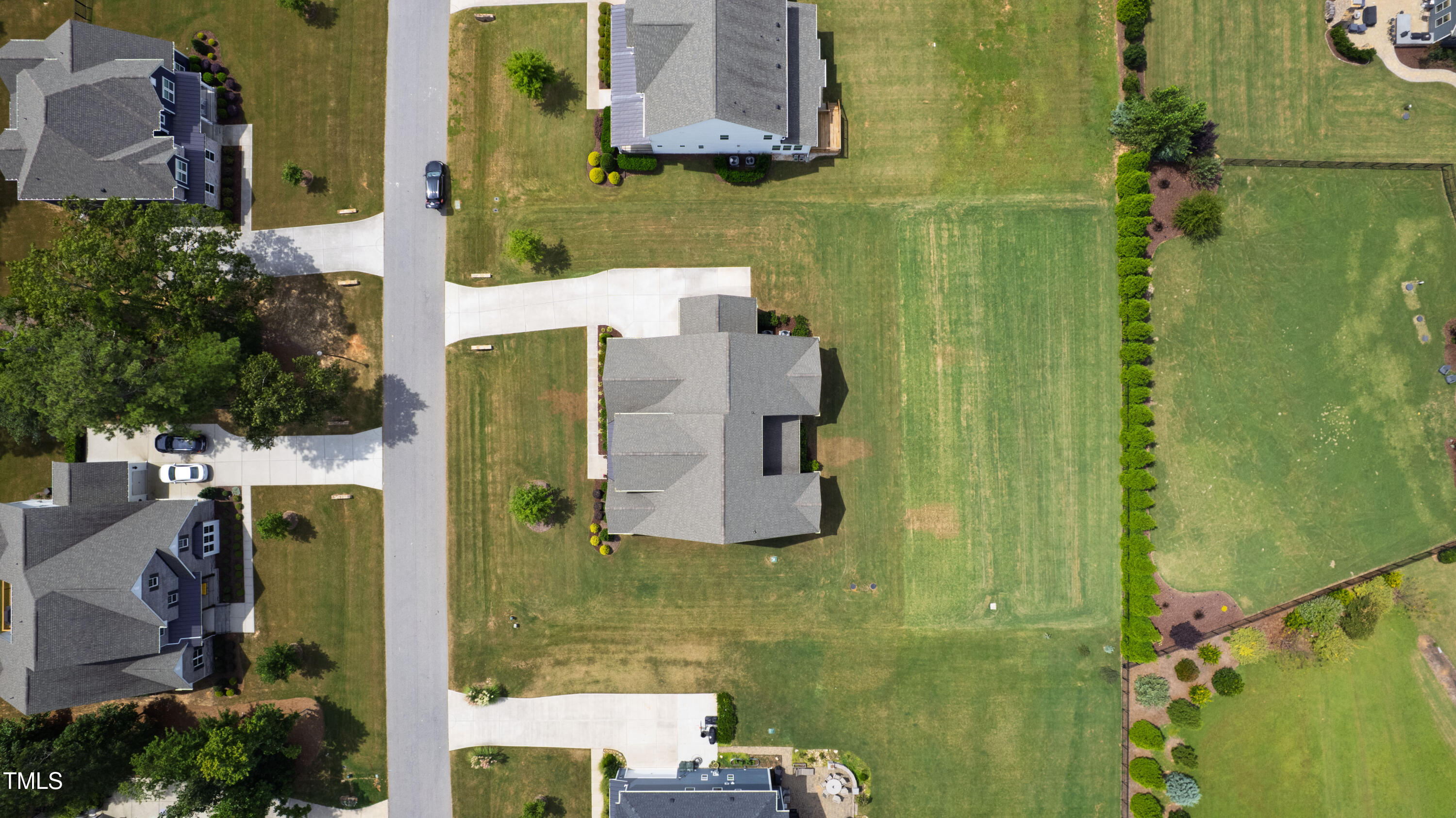 4212 Banks Stone Drive Raleigh, NC 27603 - Photo 61 of 69 an aerial view of residential houses with outdoor space and swimming pool