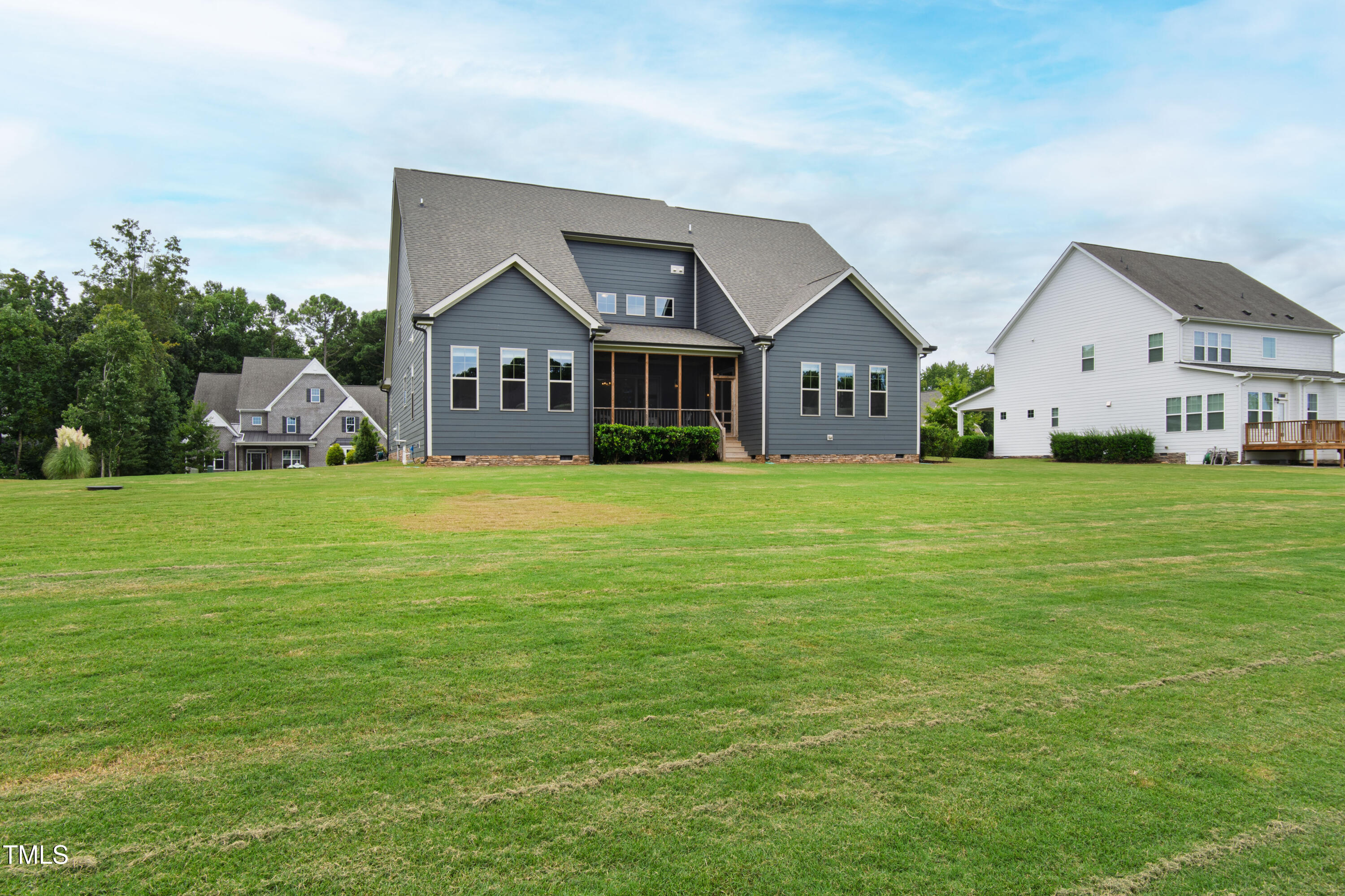 4212 Banks Stone Drive Raleigh, NC 27603 - Photo 9 of 69 a view of a house with a big yard and large trees