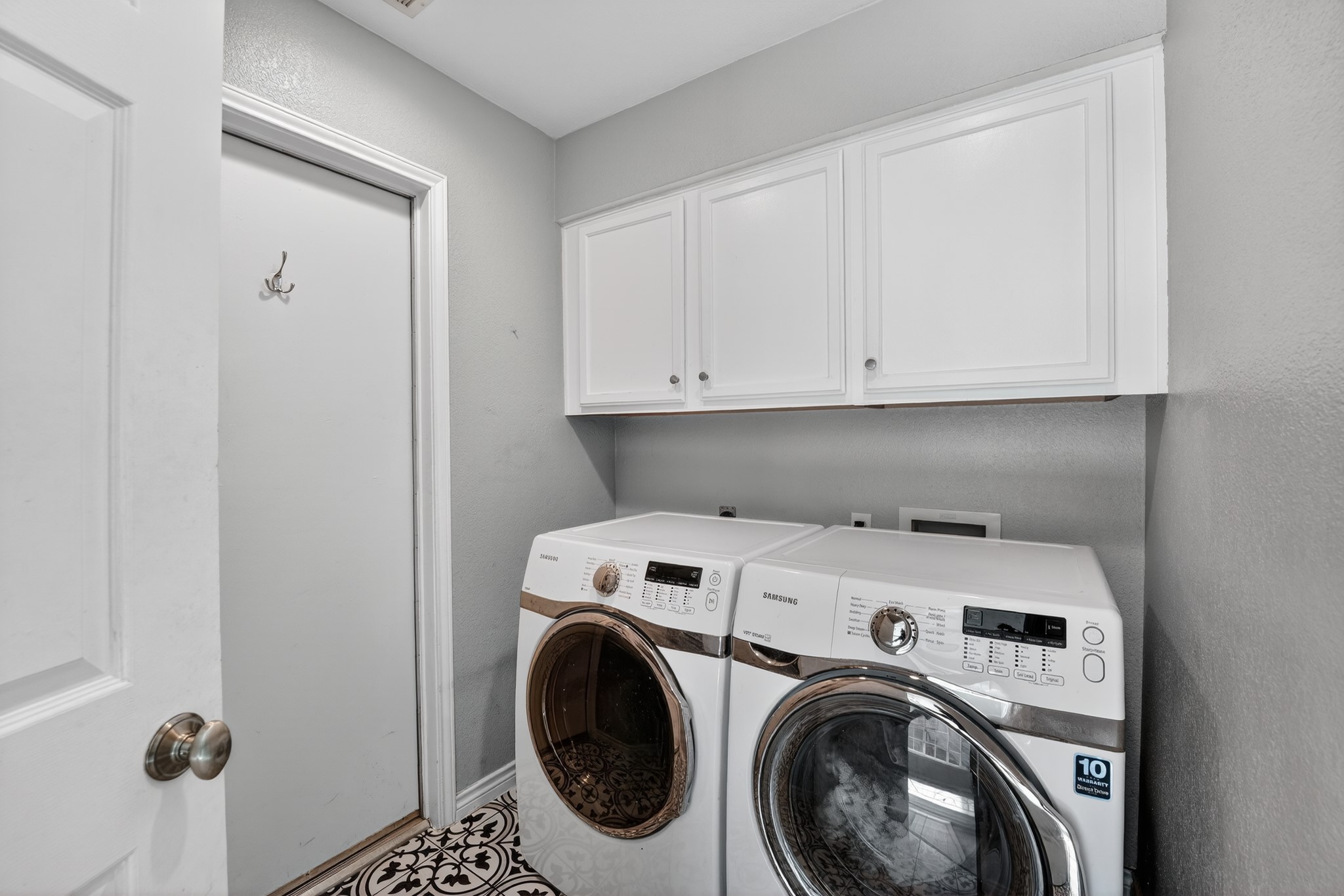 1811 Old Mill Road Cedar Park, TX 78613 - Photo 30 of 39 A dedicated laundry space offers practical convenience with overhead storage cabinets.