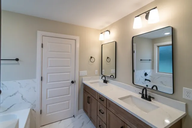 a view of a room with wooden floor
