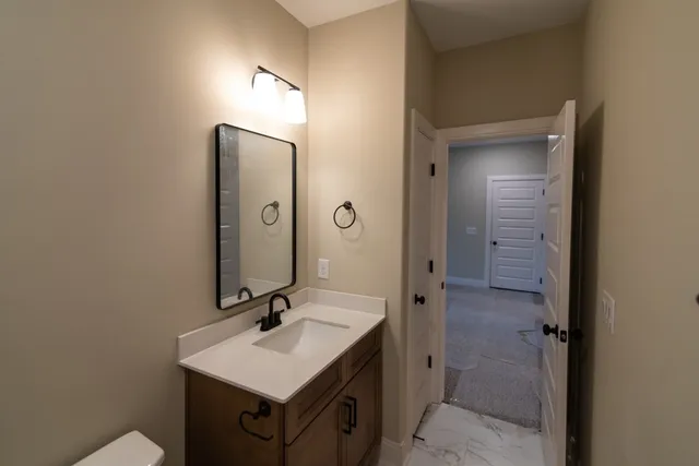 a view of a livingroom with a ceiling fan