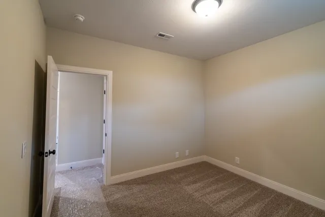 a aerial view of a house with a yard table and chairs