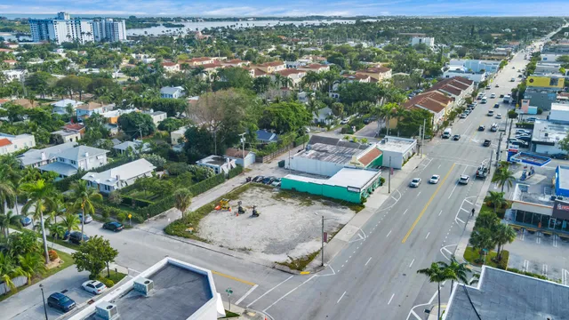 a view of a rural road with plants
