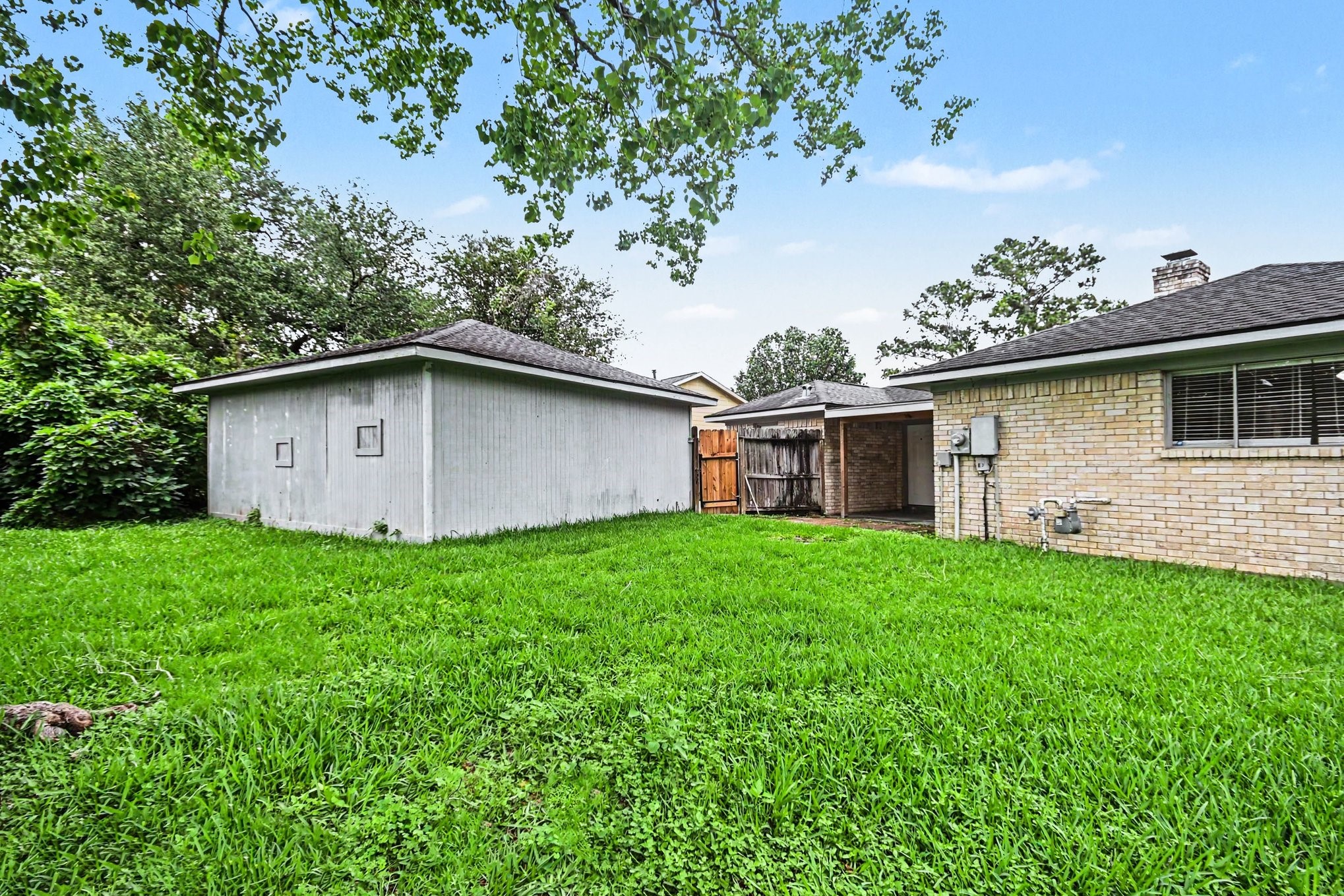 4306 Oneida Street Pasadena, TX 77504 - Photo 22 of 23 a view of a house with backyard space and garden