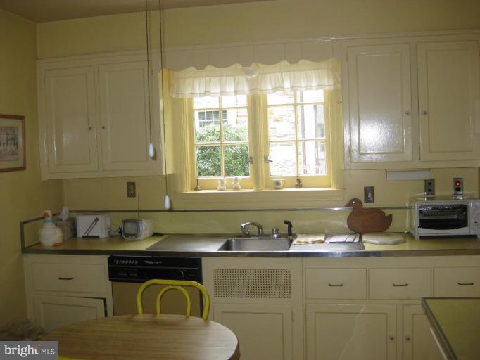 5706 Kenmore Road Baltimore, MD 21210 - Photo 12 of 18 a kitchen with sink and window