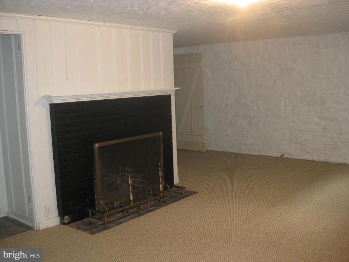 5706 Kenmore Road Baltimore, MD 21210 - Photo 17 of 18 a living room with a fireplace