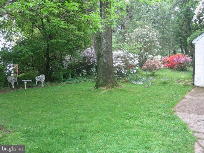 5706 Kenmore Road Baltimore, MD 21210 - Photo 3 of 18 a backyard of a house with table and chairs