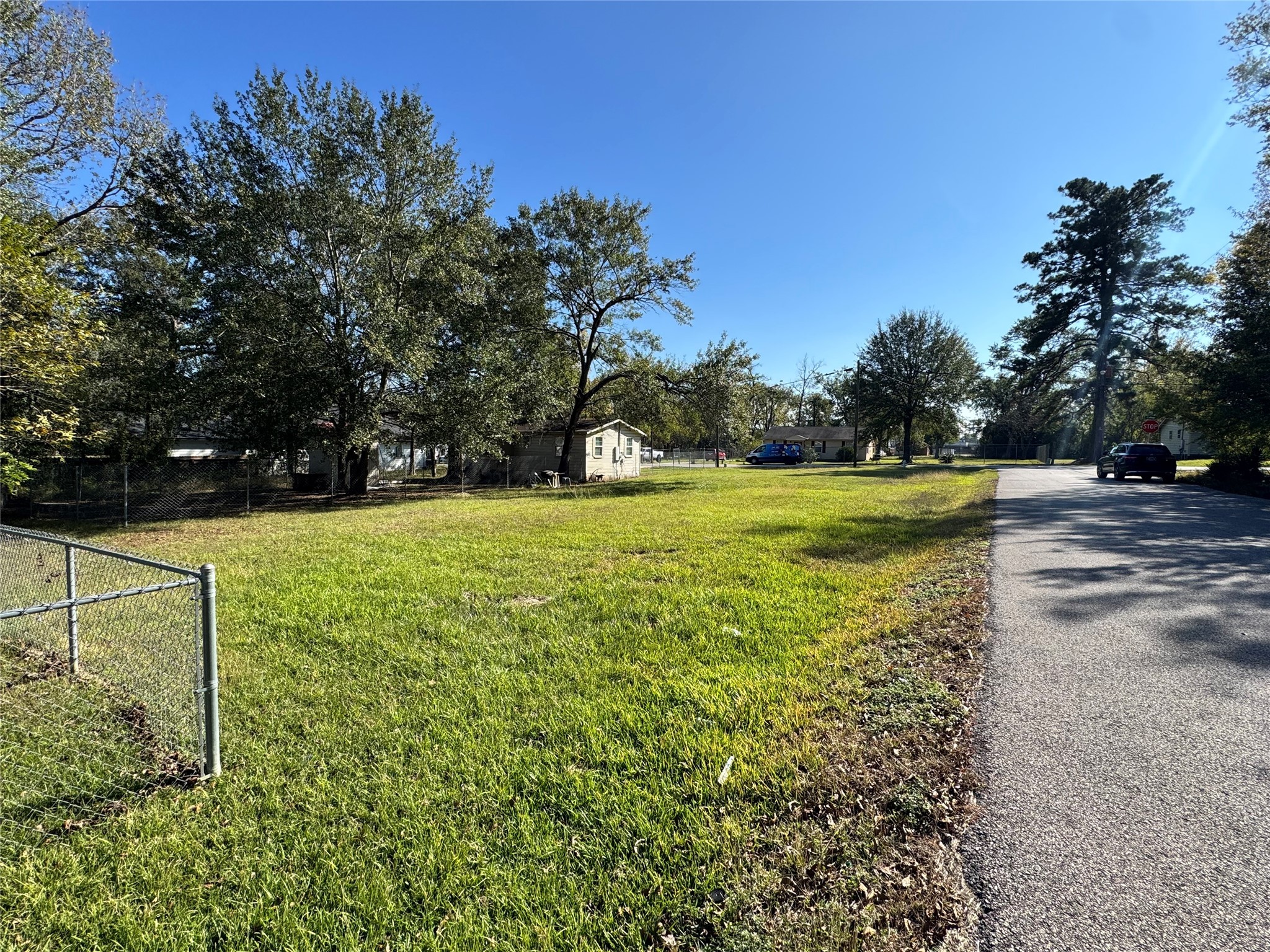 700 College Street Conroe, TX 77301 - Photo 7 of 8 a view of yard with swimming pool and green space