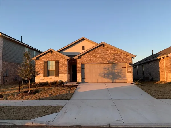 a front view of a house with yard