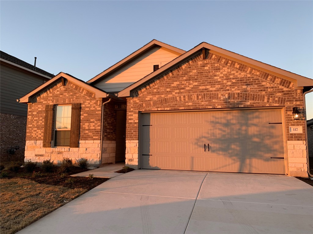 117 Peruvian Lane Georgetown, TX 78626 - Photo 14 of 33 a front view of a house with a garage