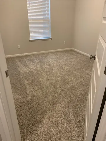 a view of gallery with wooden floor