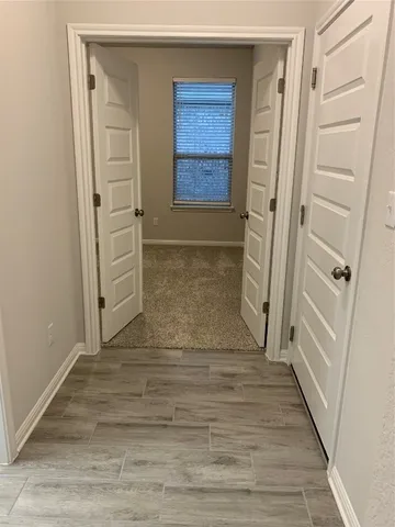 a view of a house with large windows