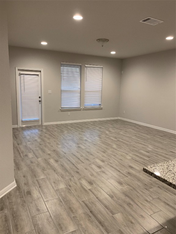 117 Peruvian Lane Georgetown, TX 78626 - Photo 33 of 33 an empty room with wooden floor and windows