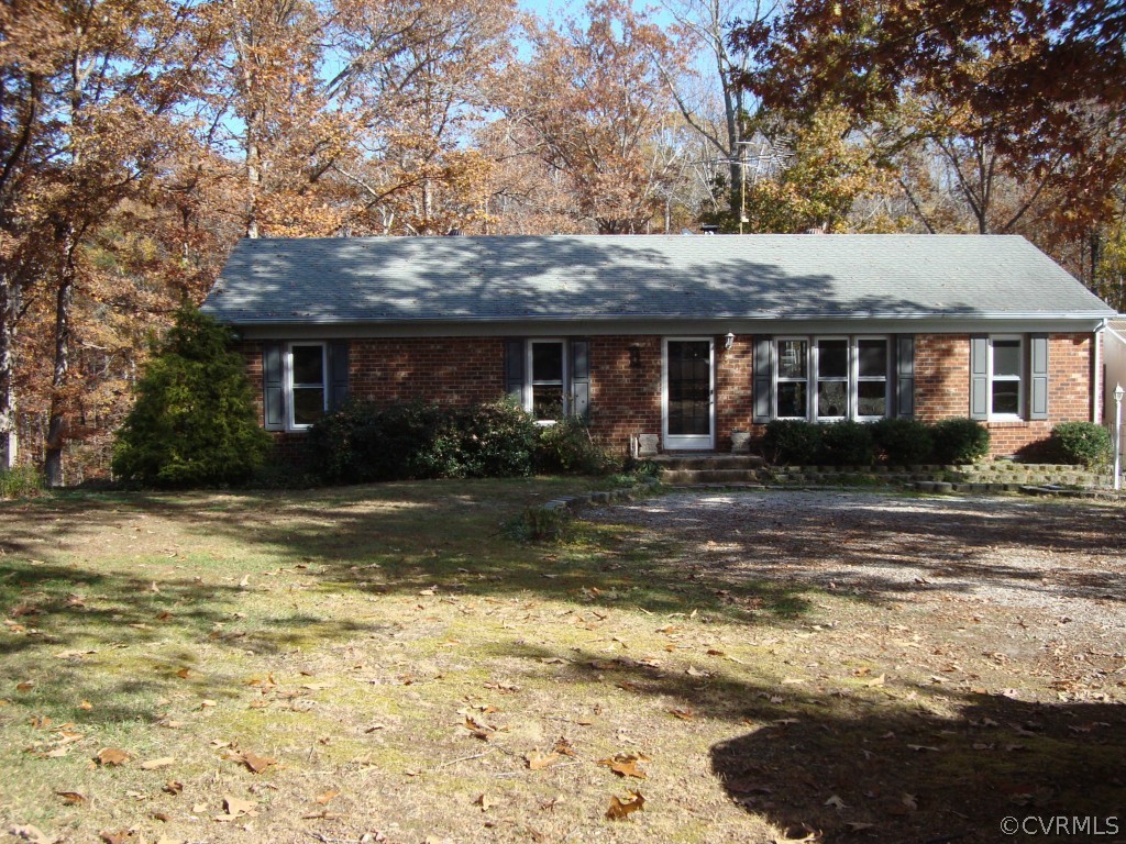 5402 Dogwood Acres Road Goochland, VA 23063 - Photo 2 of 23 a view of a house with pool and chairs next to a yard