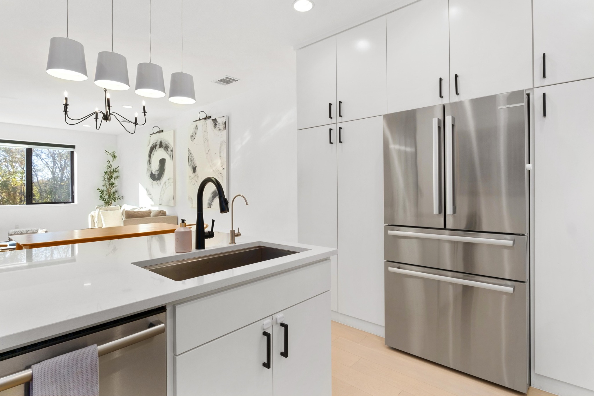 3406 East 17th Street, Unit 4 Austin, TX 78721 - Photo 12 of 32 a kitchen with stainless steel appliances a refrigerator sink and cabinets