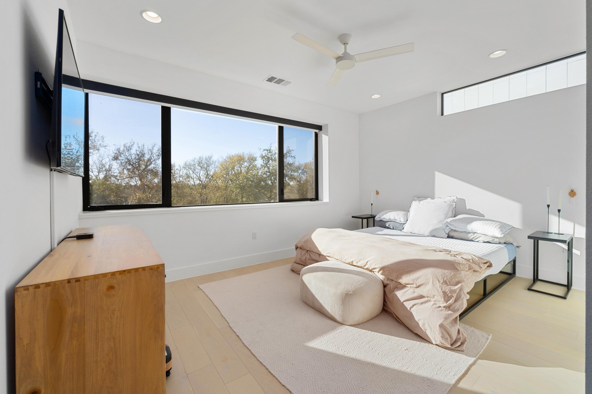 3406 East 17th Street, Unit 4 Austin, TX 78721 - Photo 15 of 32 a bedroom with a bed and a large window