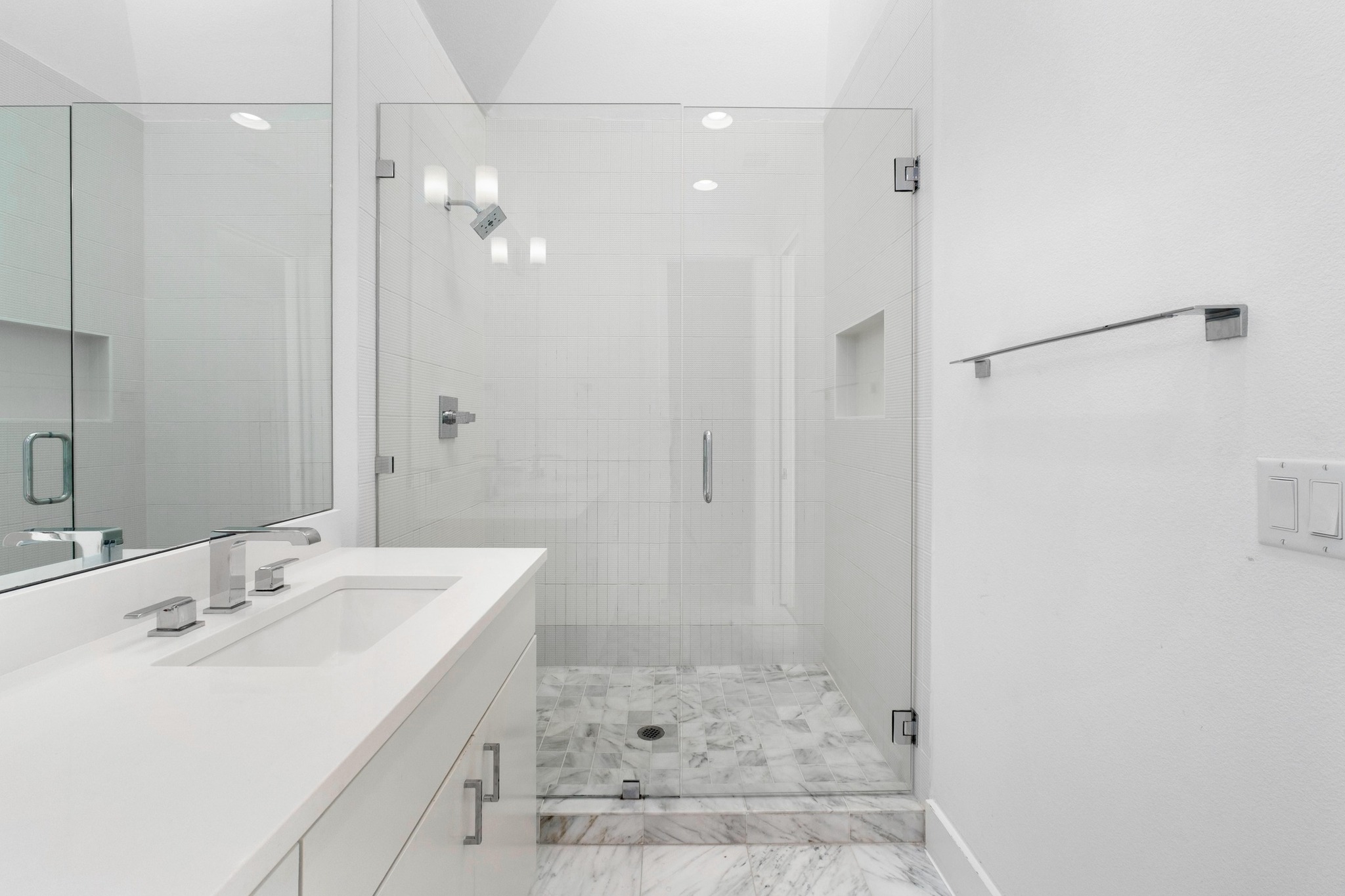 3406 East 17th Street, Unit 4 Austin, TX 78721 - Photo 19 of 32 a bathroom with a sink shower and a mirror