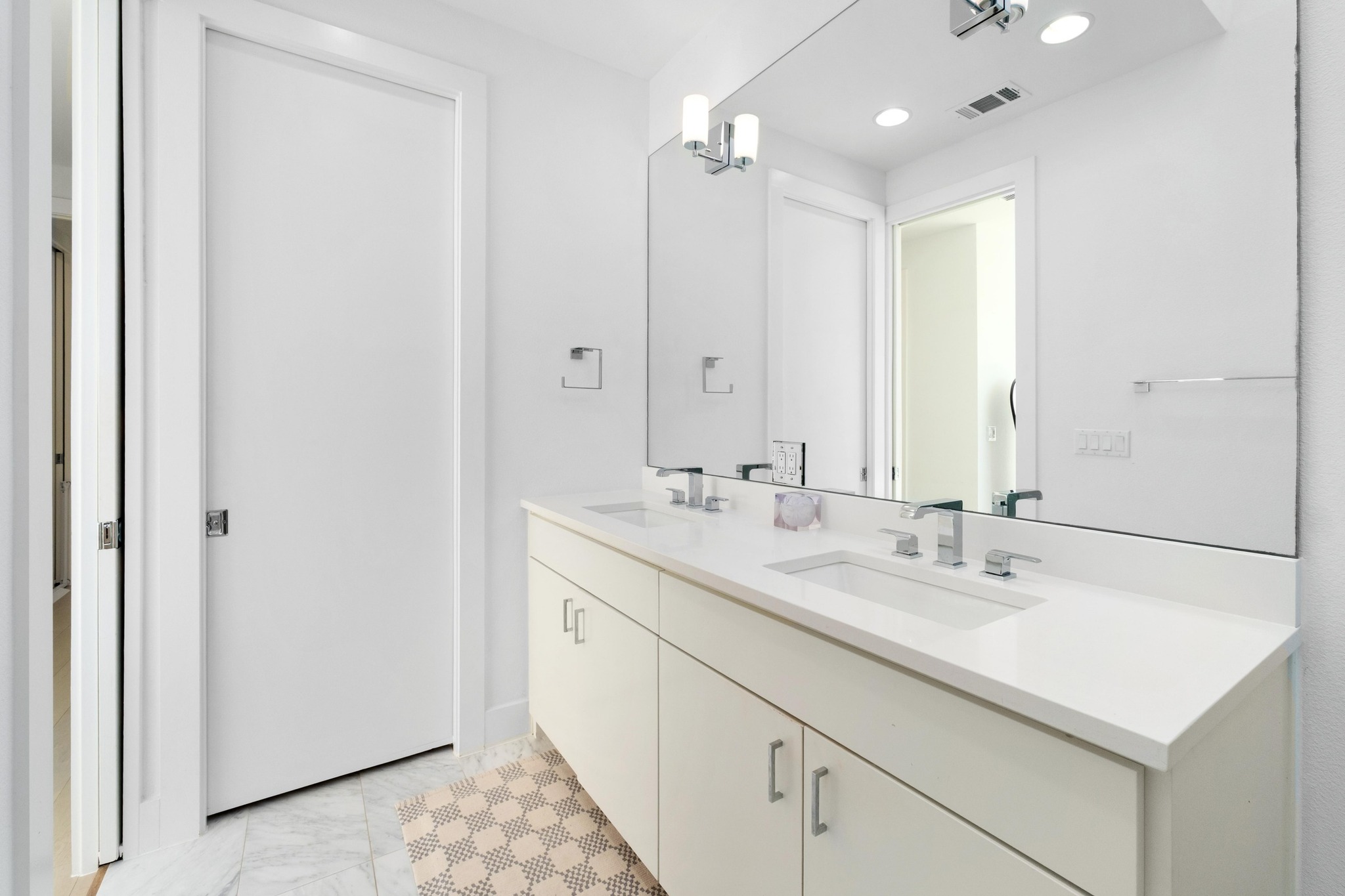 3406 East 17th Street, Unit 4 Austin, TX 78721 - Photo 20 of 32 a bathroom with a sink double vanity and a mirror