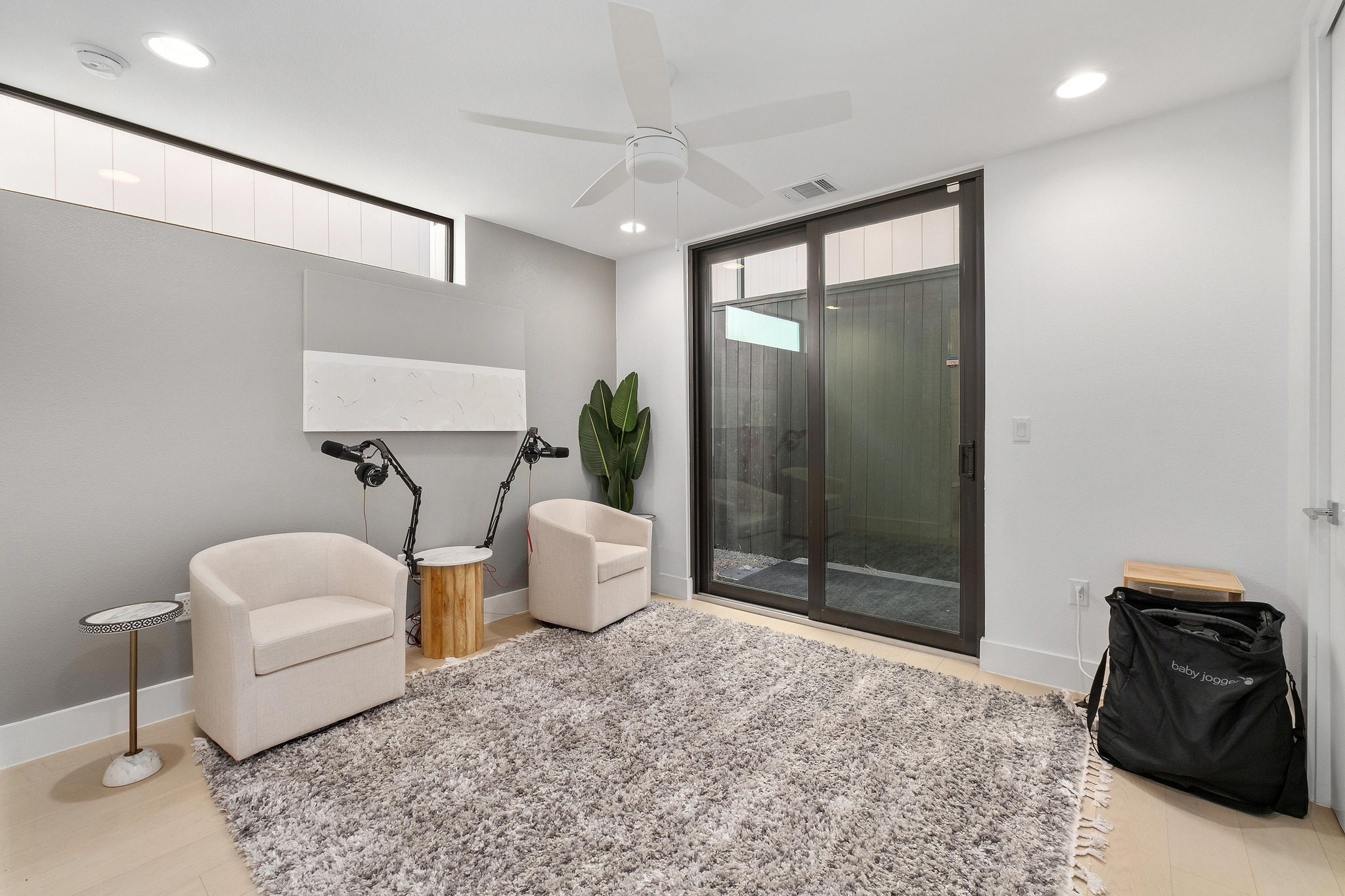3406 East 17th Street, Unit 4 Austin, TX 78721 - Photo 22 of 32 a living room with furniture a rug and a shower