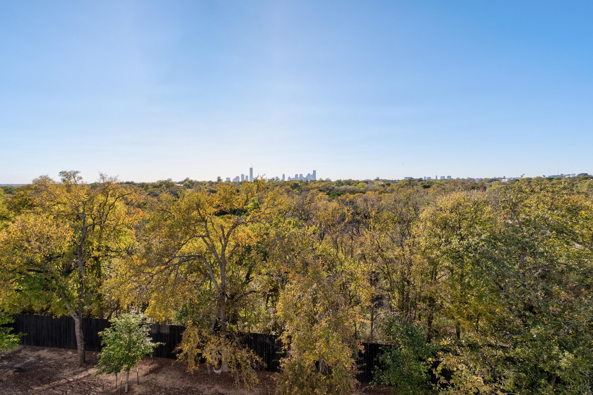 3406 East 17th Street, Unit 4 Austin, TX 78721 - Photo 30 of 32 a view of a city with lush green forest