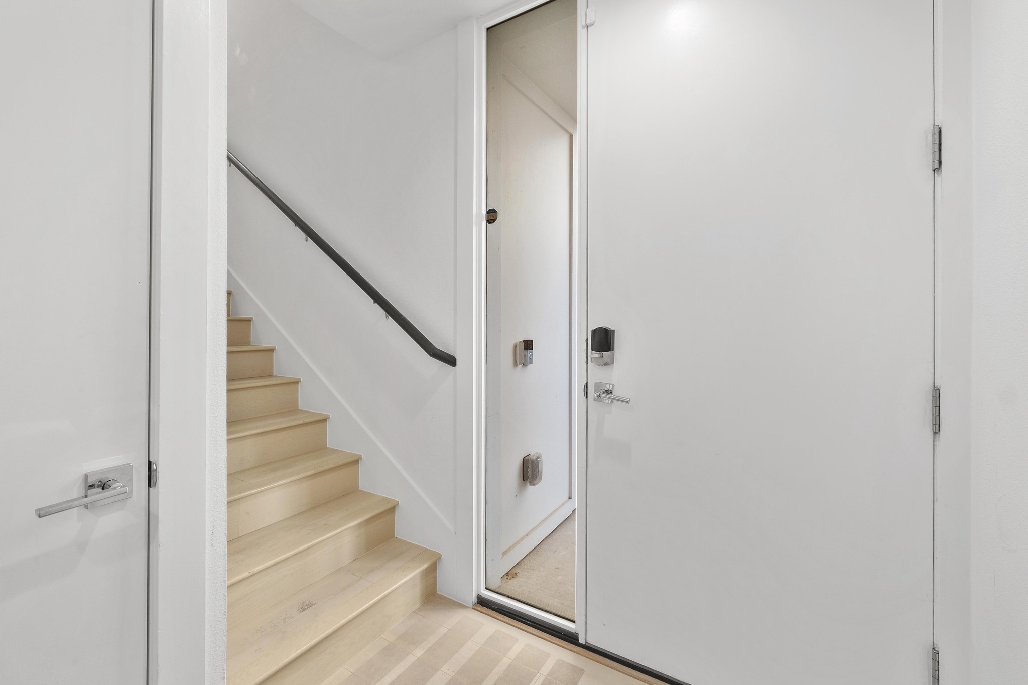 3406 East 17th Street, Unit 4 Austin, TX 78721 - Photo 4 of 32 a view of staircase with white walls and white door