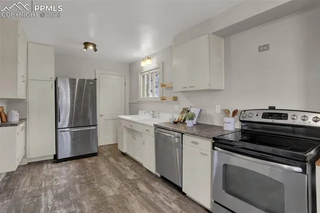 a kitchen with a stove and a refrigerator