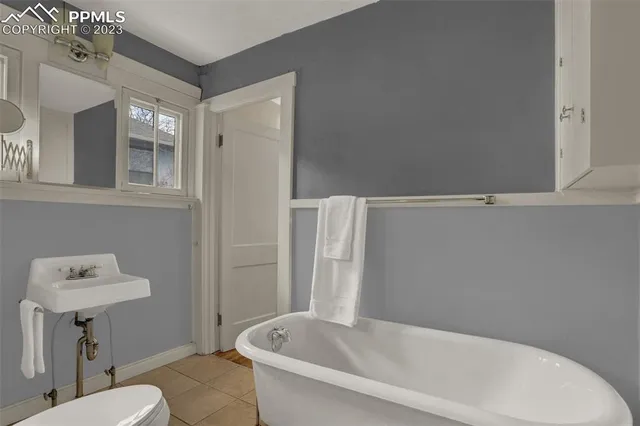 a bathroom with a bathtub and shower