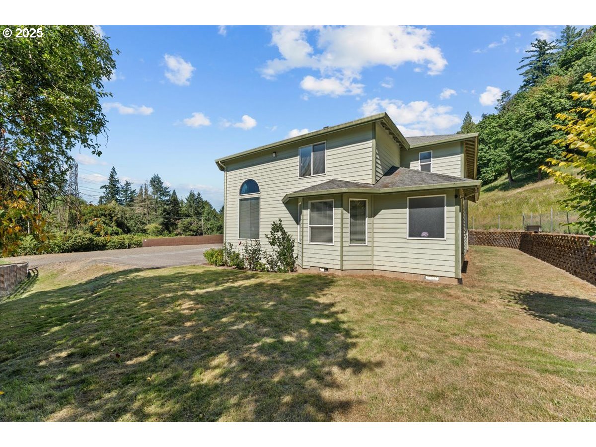 5122 Southeast Jenne Road Portland, OR 97236 - Photo 5 of 36 a front view of a house with a yard