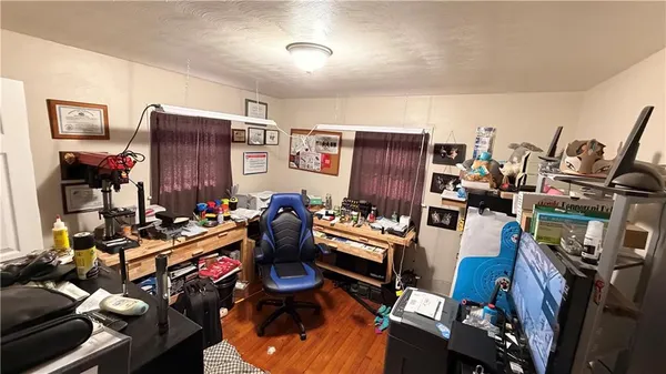 a room with furniture and gym equipment