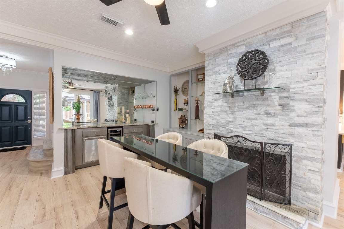 7710 Painton Lane Spring, TX 77389 - Photo 16 of 50 Family room built in wet bar with wood burning/gas log fire place