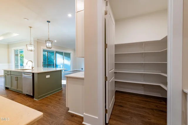 a view of kitchen with a sink and wooden floor